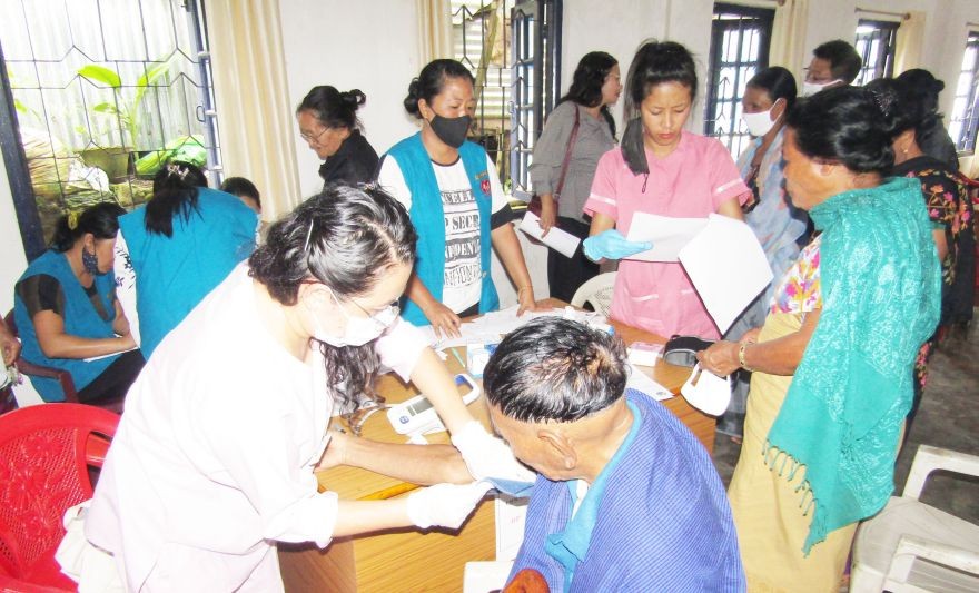 Beneficiaries interact with healthcare workers during the medical camp at Mokokchung village on July 23. (Photo Courtesy: Mokokchung CMO office)